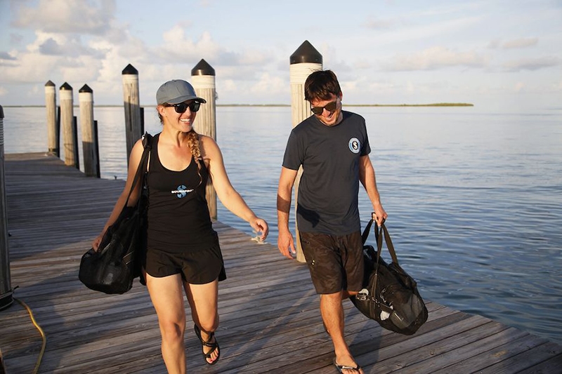 Scuba Divers on Belize Dock