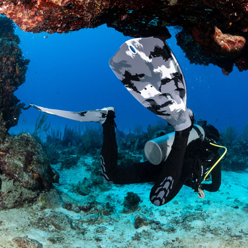 Diver underwater wearing white camo Jet fins