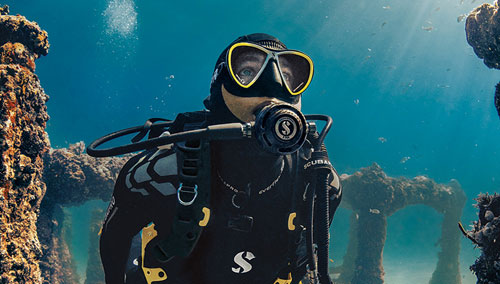 Underwater diver in SCUBAPRO gear exploring