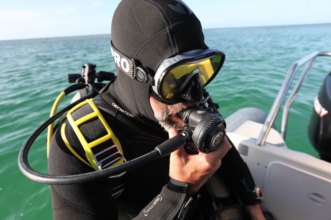 Diver on Boat with Scuba Regulator