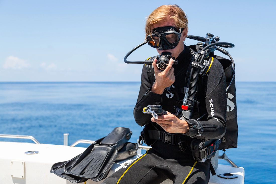 Scuba Diver Operating a Scuba Regulator